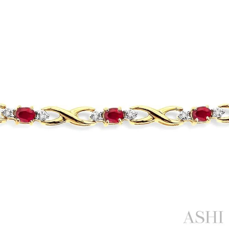 4x3mm Oval Cut Ruby and 1/10 Ctw Single Cut Diamond Bracelet in 10K Yellow Gold