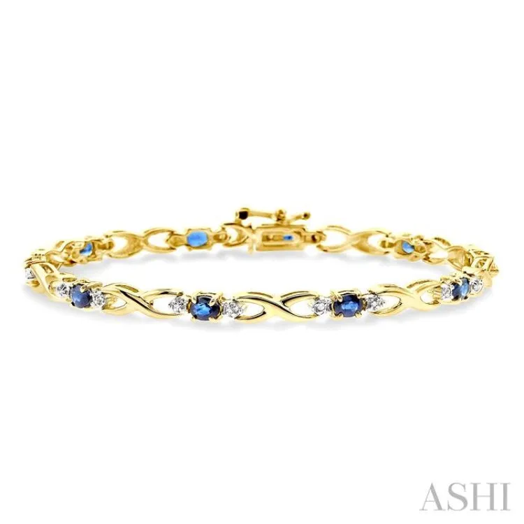 4x3mm Oval Cut Sapphire and 1/10 Ctw Single Cut Diamond Bracelet in 14K Yellow Gold