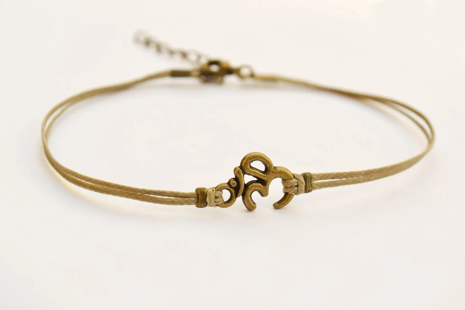 Brown cord anklet with bronze tone Om charm