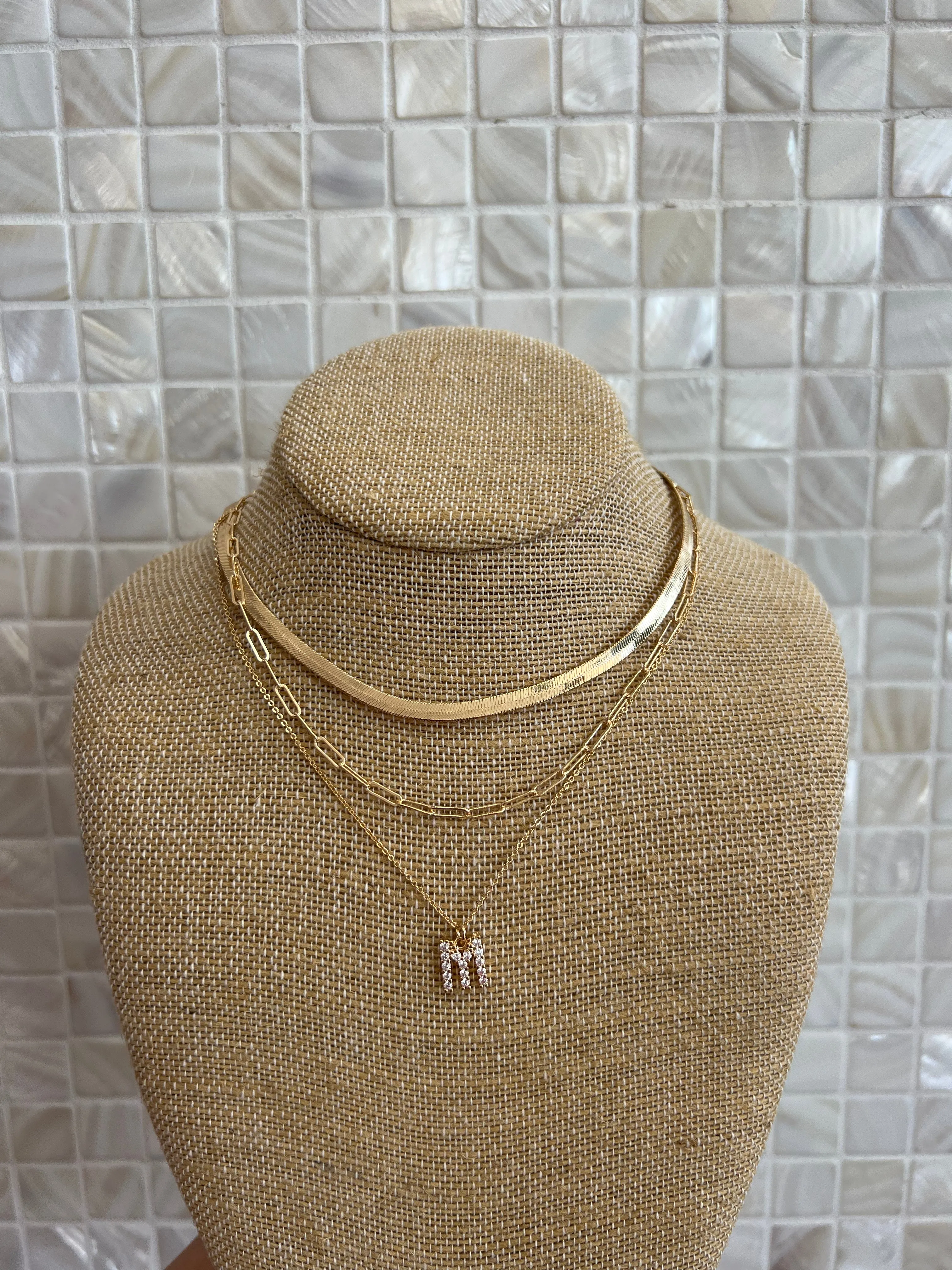 GOLD SNAKE, PAPERCLIP, AND CRYSTAL PENDANT INITIAL LAYERED NECKLACE